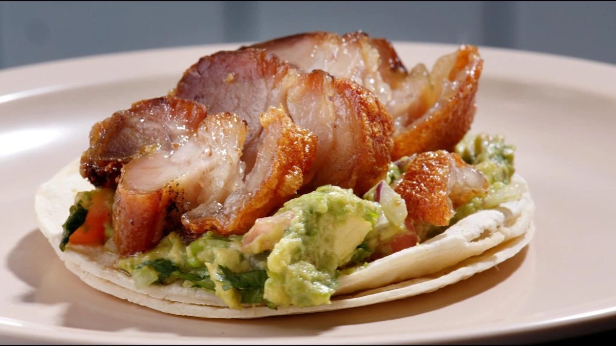 Taco de chicharrón with guacamole on a flour tortilla at Goyo Tacos